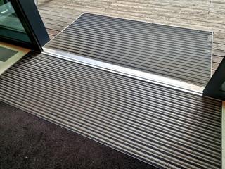 entrance house wooden terrace. office building with wooden pergola. cleaning mat flush with boards....