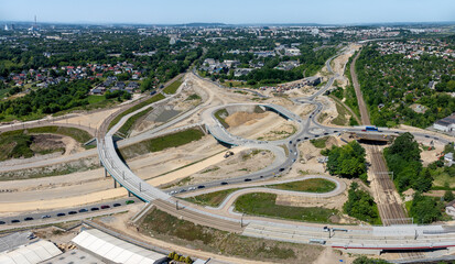 Krakow, Poland. Grebalow large highway and tramway interchange under construction. The fragment of S7 from Warsaw to A4 and last fragment of ring road around Krakow. Aerial view. State in January 2025