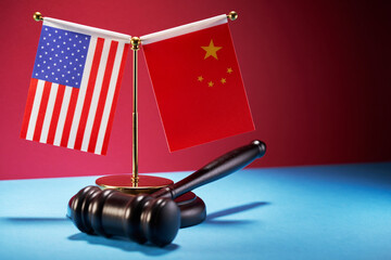 gavel hammer with usa flag and china flag as background