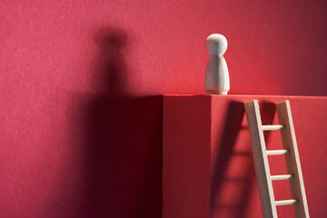 Man was climbing up the ladder having a goal.
