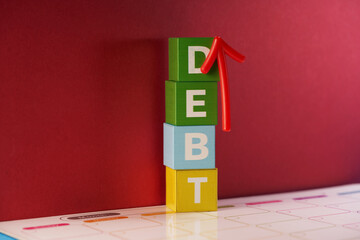 Debt growth. Red up arrow and cubes are DEBT.