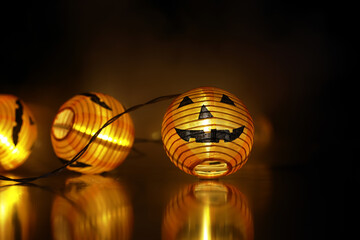 Halloween Pumpkin Lanterns Glowing in the Dark with Bat Designs for Festive Decor