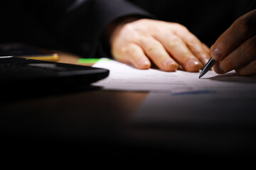 Close-Up of Hands Signing Document with Pen on Desk - Business Agreement Contract