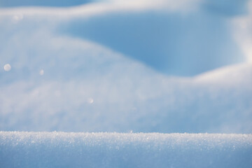 Pristine Snowy Landscape with Soft Snowdrifts and Gentle Sunlight Reflection in Winter