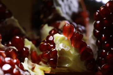 Close-Up of Juicy Pomegranate Seeds on White Pulp Background