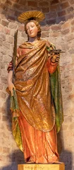 Gordijnen PIACENZA, ITALY - MAY 20, 2025: The carved polychrome staue of St. Lucia in the church Basilica di San Antonio by unknown artist  © Renáta Sedmáková