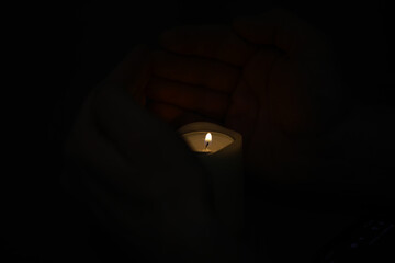 Hands Cradling a Candle in the Dark: Serenity, Peace, Protection, and Solitude