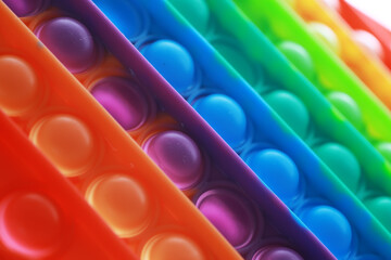 Colorful Rows of Pop It Fidget Toy Close Up - Bright Colors and Textured Surfaces for Stress Relief