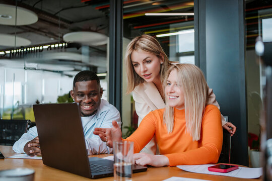 Business people having a meeting in a modern office with open space