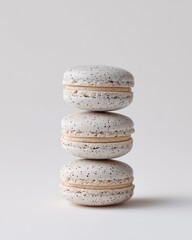 stack of macaroons, grey sesame macarons stacked vertically