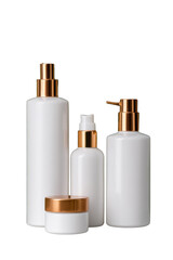 Four elegant white cosmetic bottles with golden accents, showcasing a modern design for skincare or beauty products. Png, Transparent background.