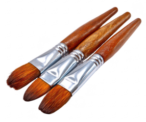 Three paintbrushes, close-up,  with wooden handles and  metal ferrule