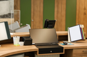 Modern and tidy reception or office desk with computer, keyboard, and organized folders, symbolizing customer service, administration, and workplace professionalism