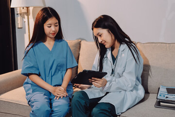 A doctor uses a stethoscope to check the heartbeat of his patient. Patients must undergo a yearly...