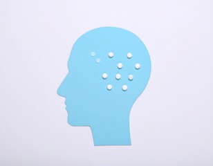 Paper-cut silhouette of a head on white background