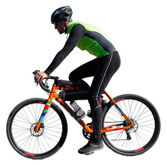 Cyclist riding bicycle on road against clear sky