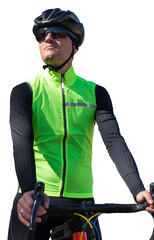 A man in clothes stands with a bicycle on an autumn sunny day. Cyclist in the park.