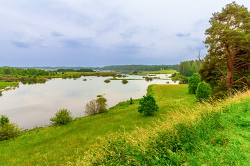 Landscape with river and blue sky. Pushkinskie Gory, Pskov region, Russia, view from ancient site...