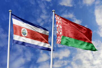 3D illustration. Costa Rica and Belarus flags waving in the sky. High detailed waving flag. 3D...