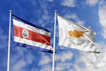 3D illustration. Costa Rica and Cyprus  flags waving in the sky. High detailed waving flag. 3D render. Flags fluttered in the cloudy sky, symbolizing diplomatic relations.