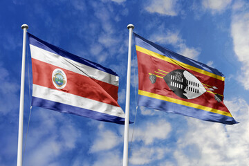 3D illustration. Costa Rica and Eswatini flags waving in the sky. High detailed waving flag. 3D render. Flags fluttered in the cloudy sky, symbolizing diplomatic relations.