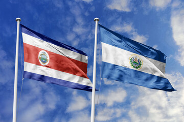 3D illustration. Costa Rica and El Salvador flags waving in the sky. High detailed waving flag. 3D render. Flags fluttered in the cloudy sky, symbolizing diplomatic relations.