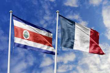 3D illustration. Costa Rica and France flags waving in the sky. High detailed waving flag. 3D render. Flags fluttered in the cloudy sky, symbolizing diplomatic relations.