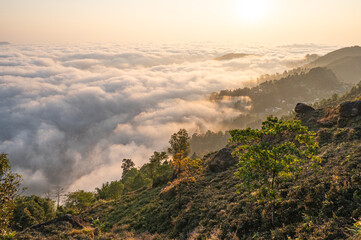 The ocean of clouds entering the silent hills.