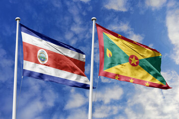3D illustration. Costa Rica and Grenada flags waving in the sky. High detailed waving flag. 3D render. Flags fluttered in the cloudy sky, symbolizing diplomatic relations.