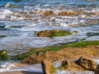  Dumping Seas Lift Sand Into Rocks
