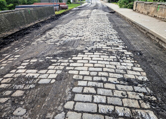 After removing the asphalt pavement, granite paving stones appeared on the road. Historical...