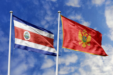 Costa Rica and Montenegro flags proudly waving against a vibrant blue sky, symbolizing...