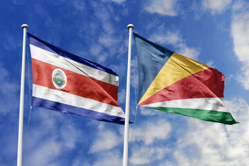 Costa Rica and Seychelles National Flags Waving Harmoniously Under a Clear Blue Sky, Symbolizing Diplomatic Bonds and Global Cooperation.