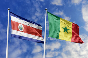 Costa Rica and Senegal National Flags Waving Proudly Under a Bright Blue Sky, Symbolizing Diplomatic Relations and Global Connections.