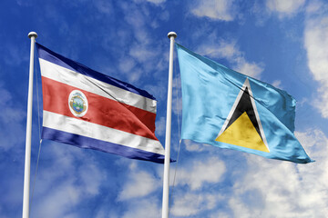 Costa Rica and Saint Lucia National Flags Waving Harmoniously Under a Bright Blue Sky, Symbolizing Diplomatic Bonds and Caribbean-Central American Ties.