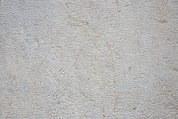 Detailed Close-Up of Light Textured Wall Surface with Subtle Imperfections