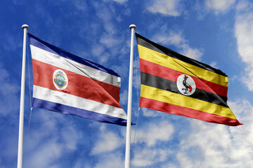 Flags of Costa Rica and Uganda Waving Together Under a Bright Blue Sky, Symbolizing Diplomatic Ties and African-Central American Relations.