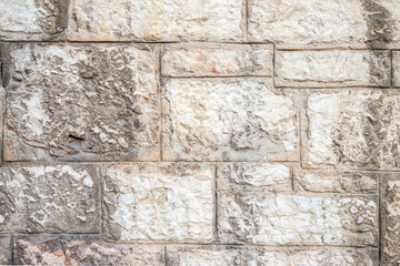 Close-Up of a Textured Stone Wall with Light and Neutral Tones