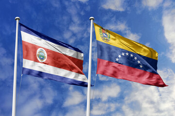 Flags of Costa Rica and Venezuela Waving Side-by-Side Under a Bright Blue Sky, Symbolizing Latin American Connections and Bilateral Relations.