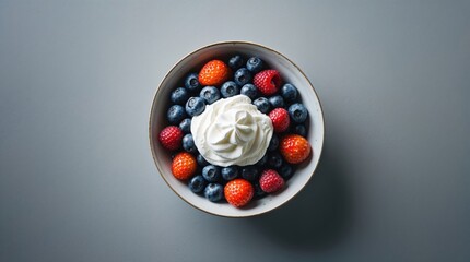 Bowl of berries with whipped cream on top