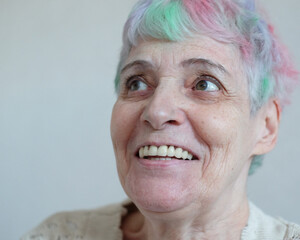 I see no good reason to act my age. A cheerful elderly woman with multi-colored hair.