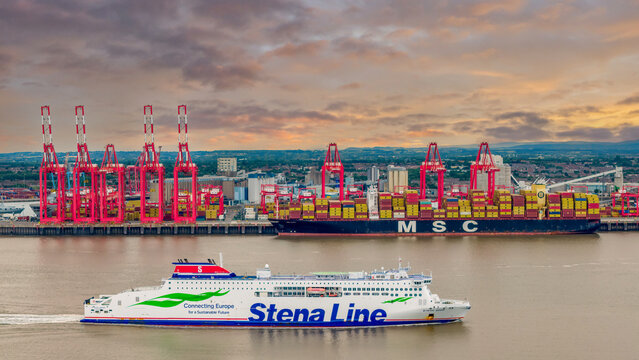 Stena Line ferry passes the port of Liverpool with a container ship unloading. MSC ship at the docks and Irish Ferry in Liverpool, United Kingdom 