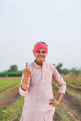 Young Indian farmer showing finger after voting