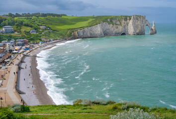 Landscape with spectacular beaches and high cliffs at Etretat, Normandy, France.