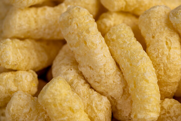 corn sticks made from corn flour, a large number of ready-made corn sticks for eating or making breakfast with milk, closeup