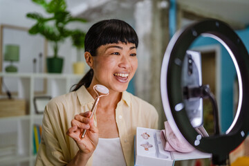 Japanese woman live streaming and show natural jade stone roller