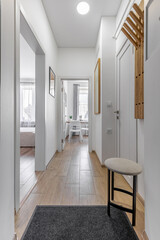 Modern Entry Hallway with View into Kitchen and Bedroom