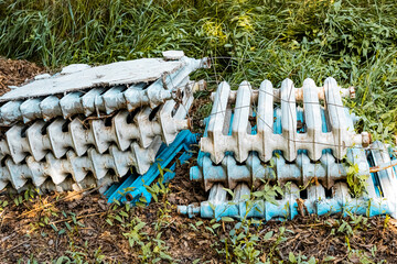 old cast iron batteries lie on the ground. High quality photo