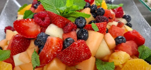 Vibrant and Fresh Assortment of Sliced Fruits and Berries for Healthy Eating