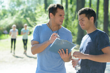 running coach talking to athlete